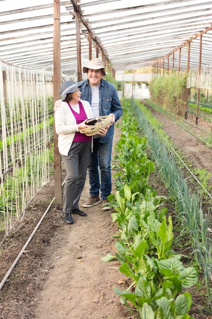 retired-couple-having-great-day-greenhouse_23-2147562161